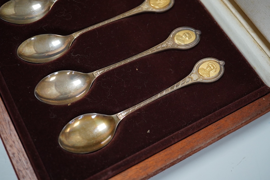 An Elizabeth II cased set of six ‘The Sovereign Queens’ commemorative parcel gilt silver teaspoons by John Pinches, London, 1977.